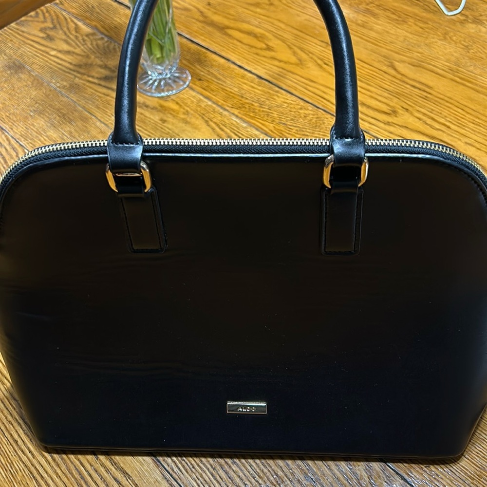 Aldo Faux leather handbag. Shoulder strap missing. Good condition. Black.